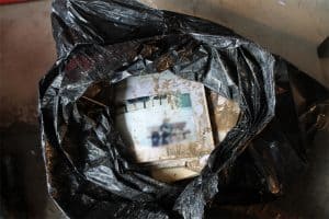 Flood Damaged Albums in Garbage Bag, Cleaning wet photos, Cleaning Wet Albums